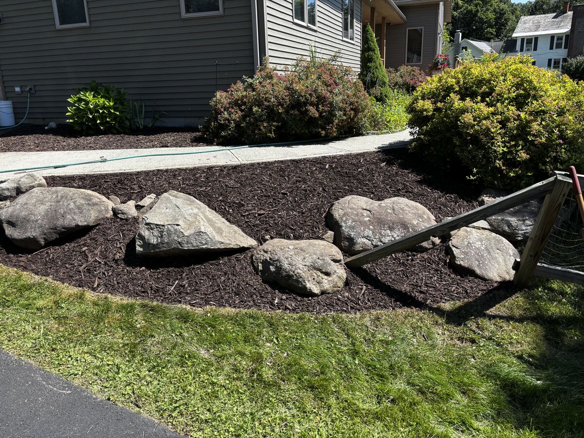 Boulder-accented mulch planting bed